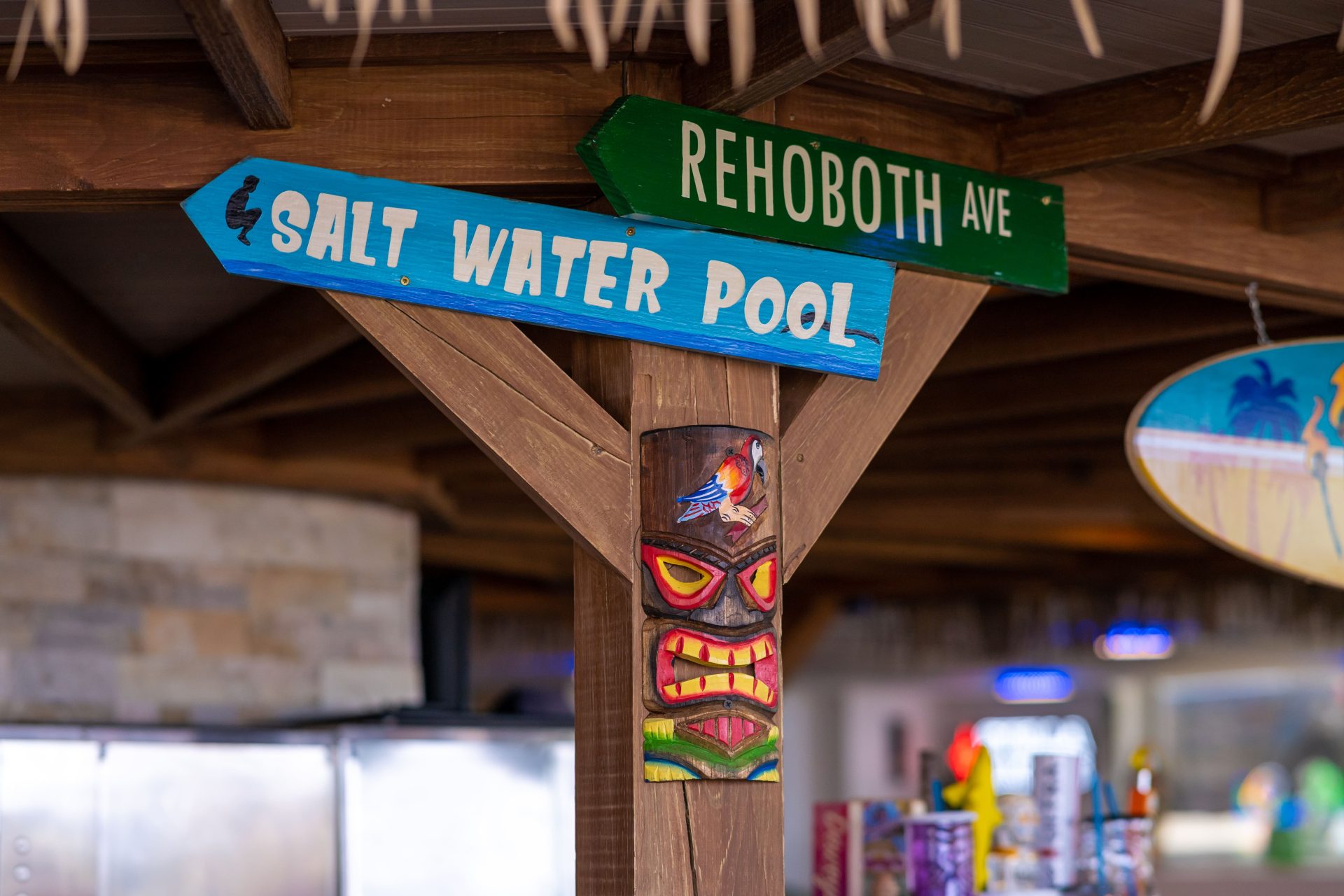 signs at kiwis kove that read rehoboth ave and salt water pool